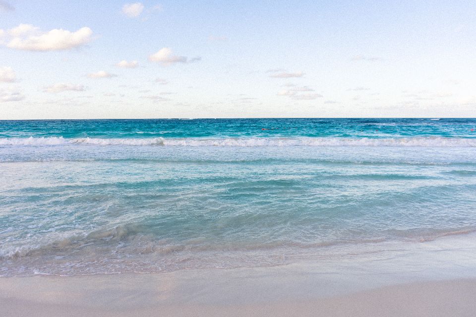 Gentle ocean water at the horizon.