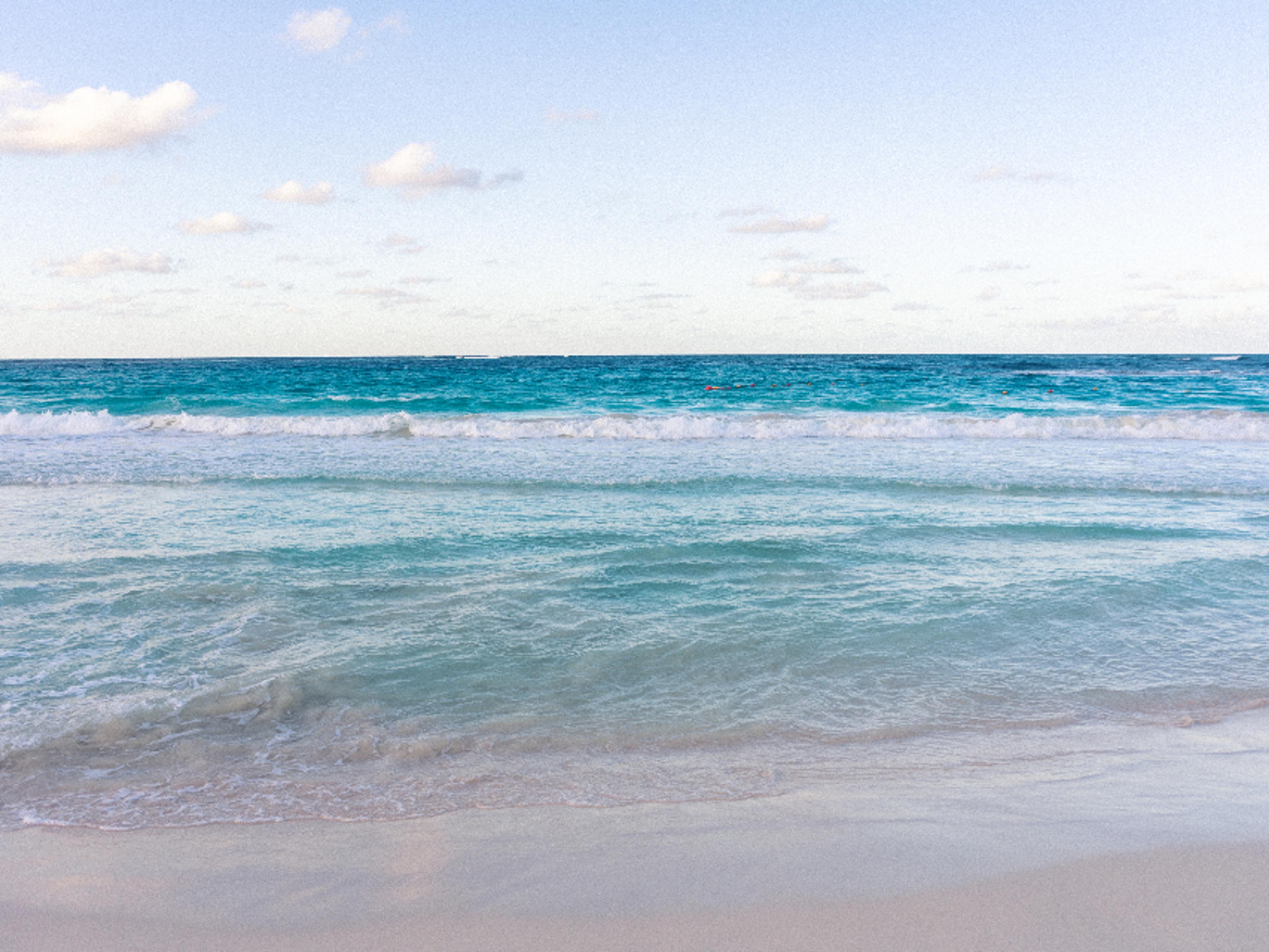 Gentle ocean water at the horizon.