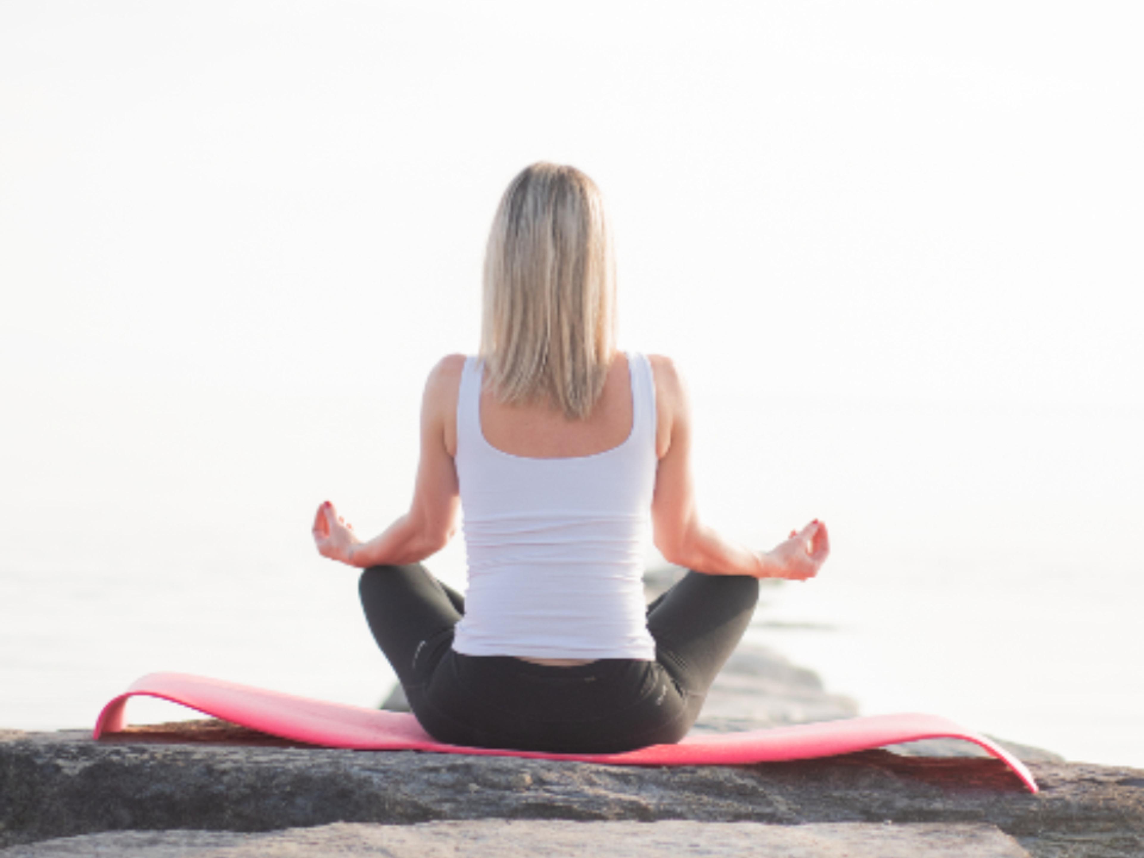 A person practicing mindfulness in soft light.