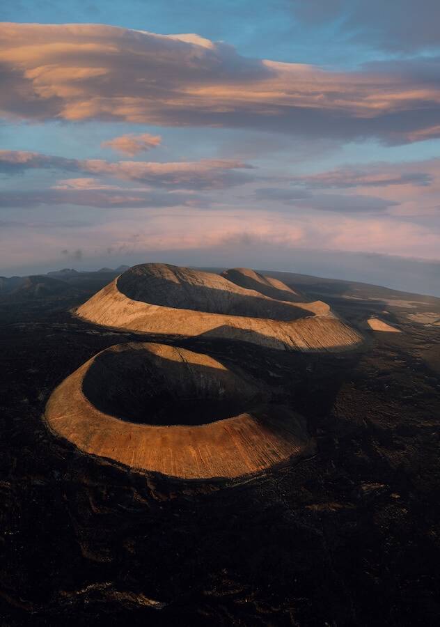 Aerial view of volcanic craters on Lanzarote in the evening light