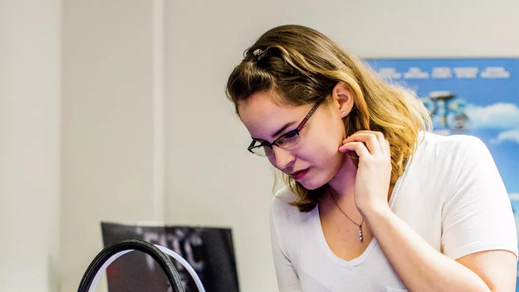Student focusing on audio production tasks