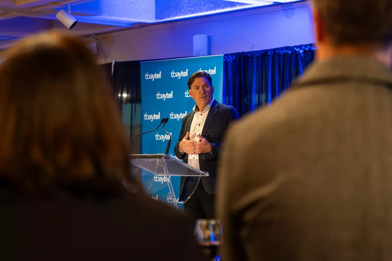 Lyle Knudsen giving speech at Community Partners event