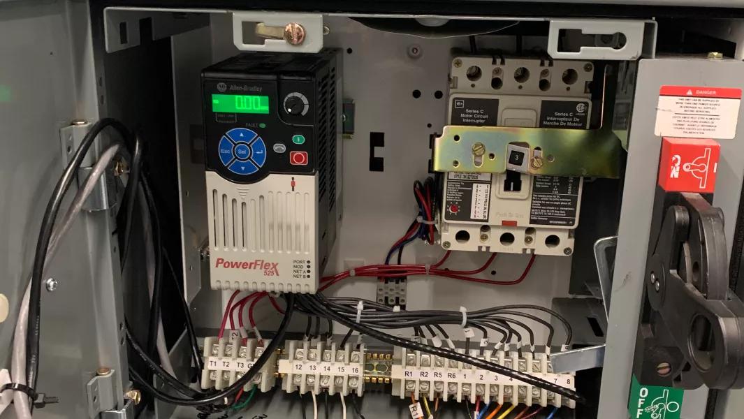 Close-up of wiring and components inside an electrical control cabinet