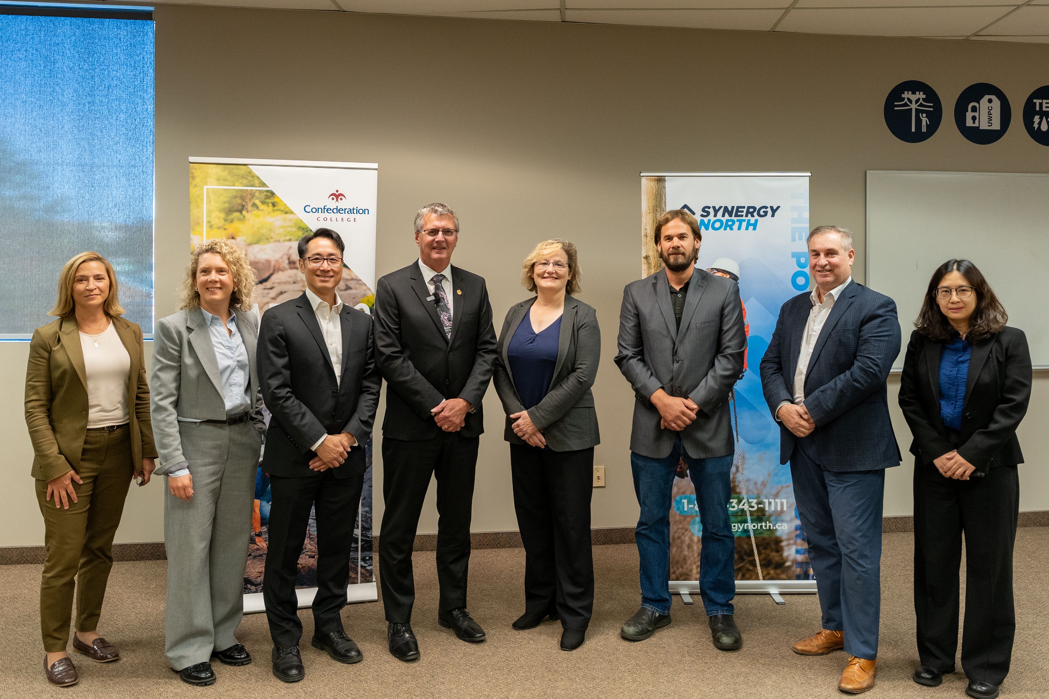 College and industry partners stand together at Confederation College announcing $3.2M funding for clean energy upgrades.