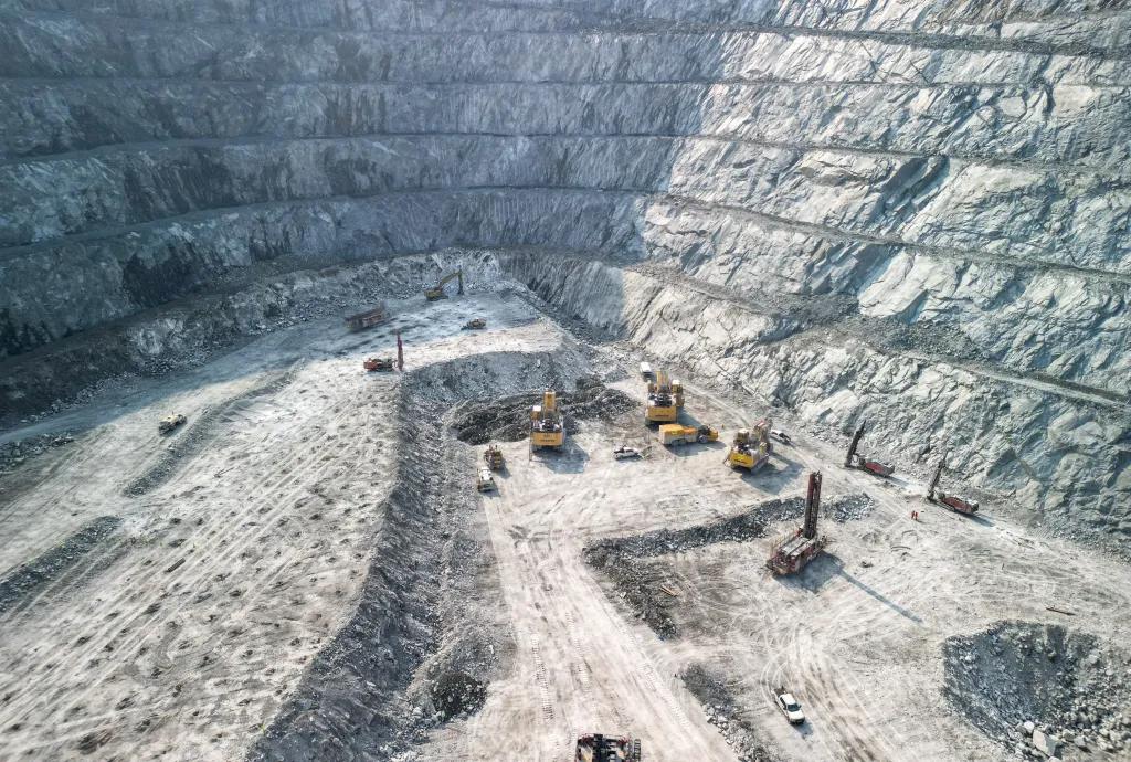 Large quarry with excavators and drills