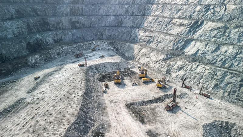 Large quarry with excavators and drills