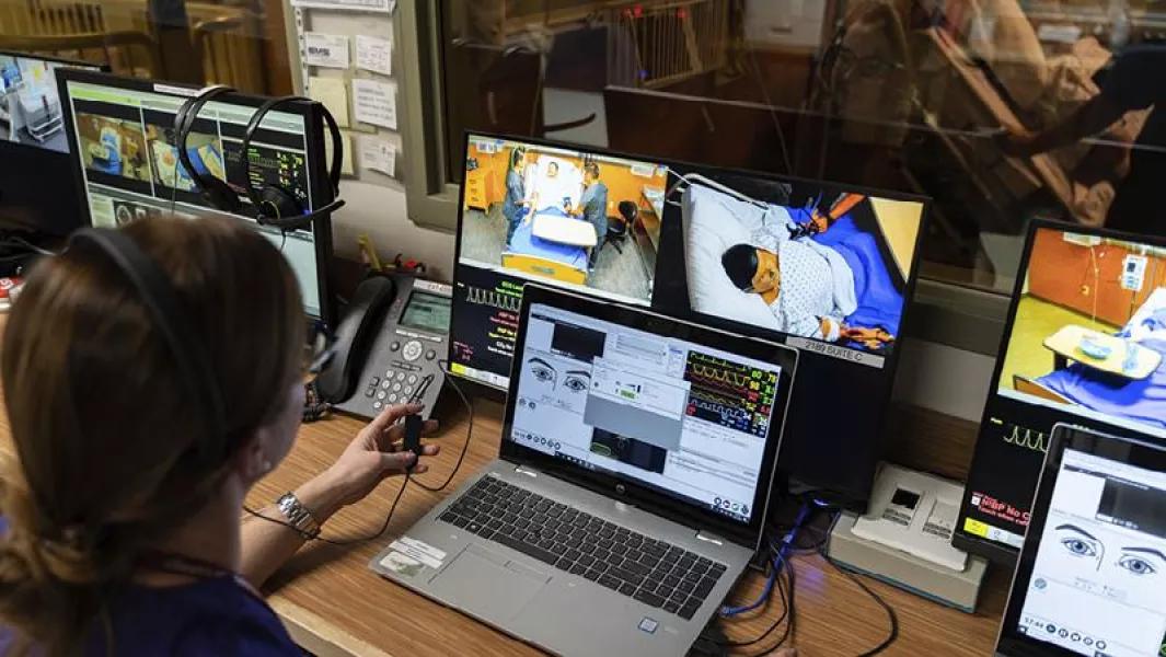 Instructor monitoring simulation exercises on multiple screens