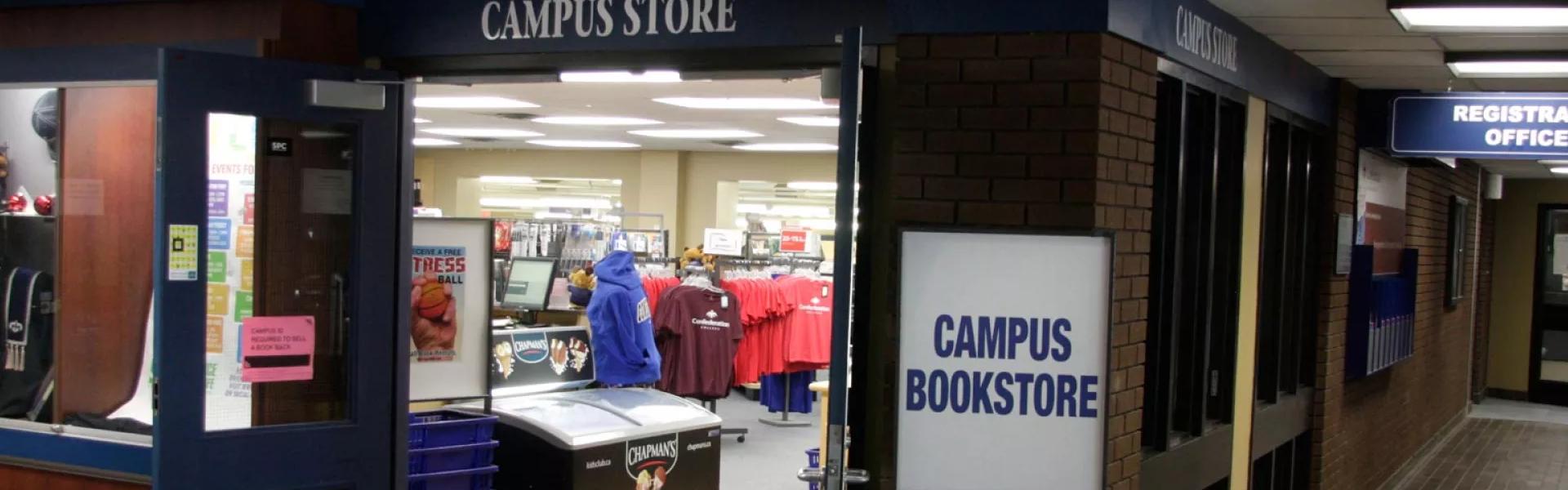 Campus store entrance with bookstore signage and merchandise displays visible inside