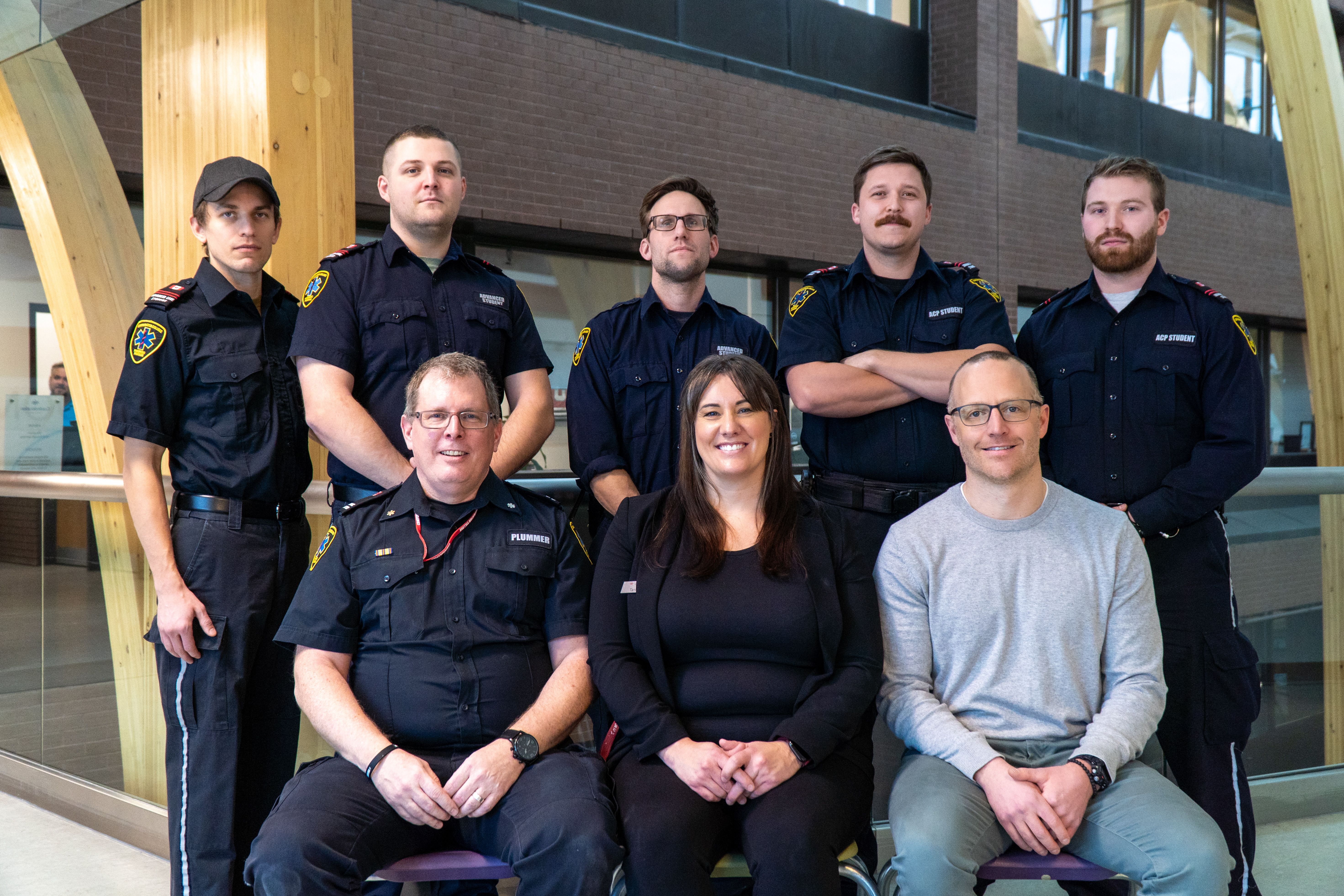 Paramedic students and instructors posing for a group photo on campus