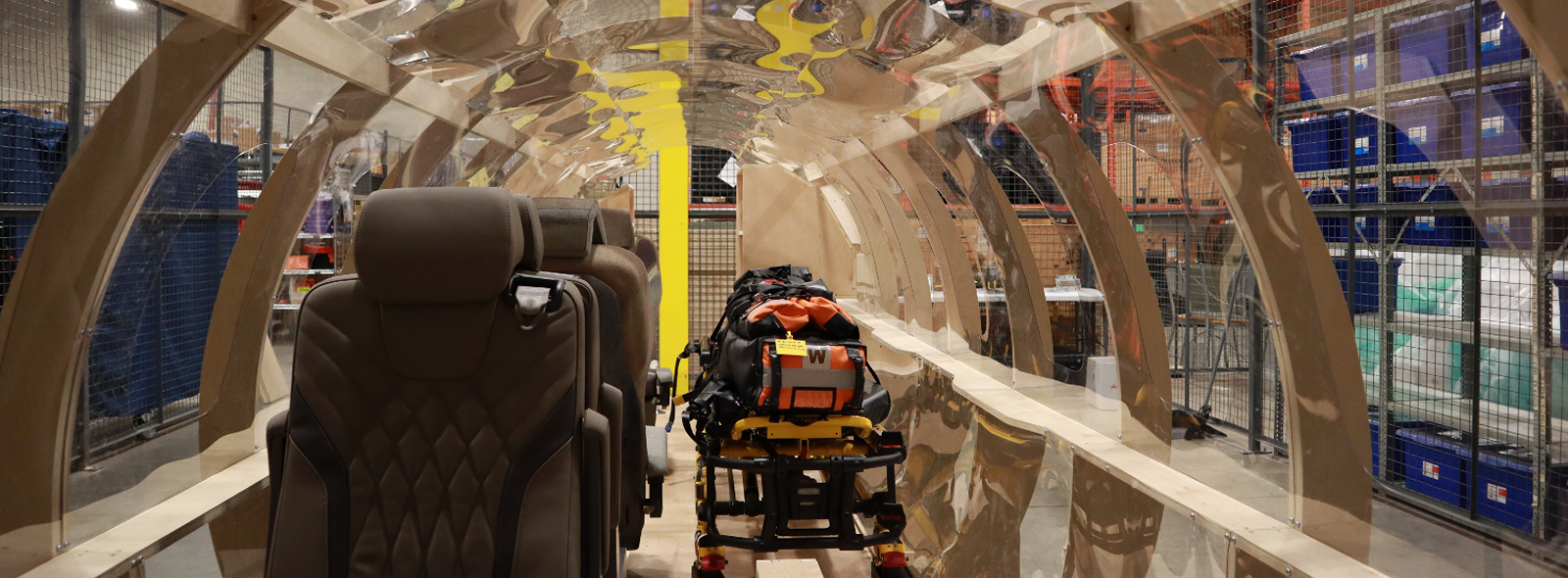 Students testing a PC-24 air ambulance interior mock-up for Ornge medical transport training and workflow design