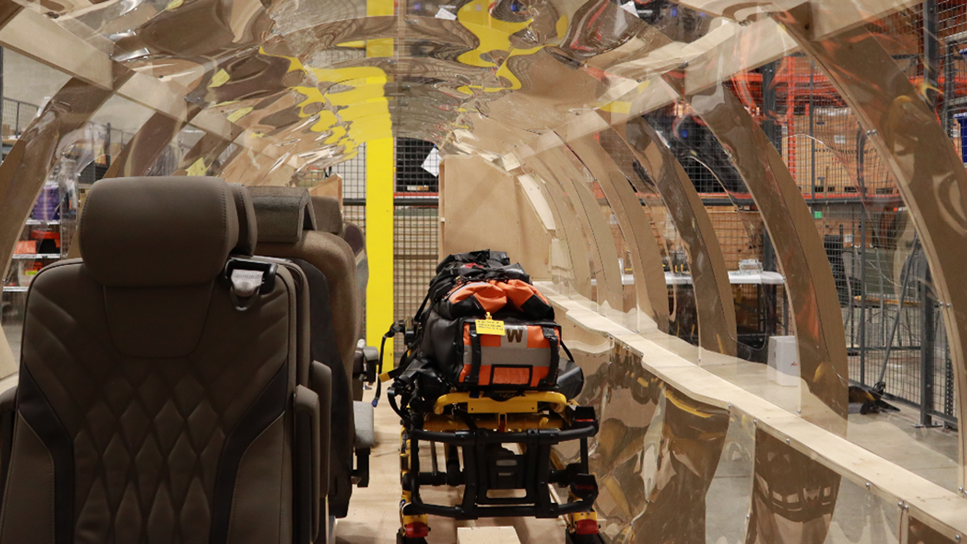 Students testing a PC-24 air ambulance interior mock-up for Ornge medical transport training and workflow design