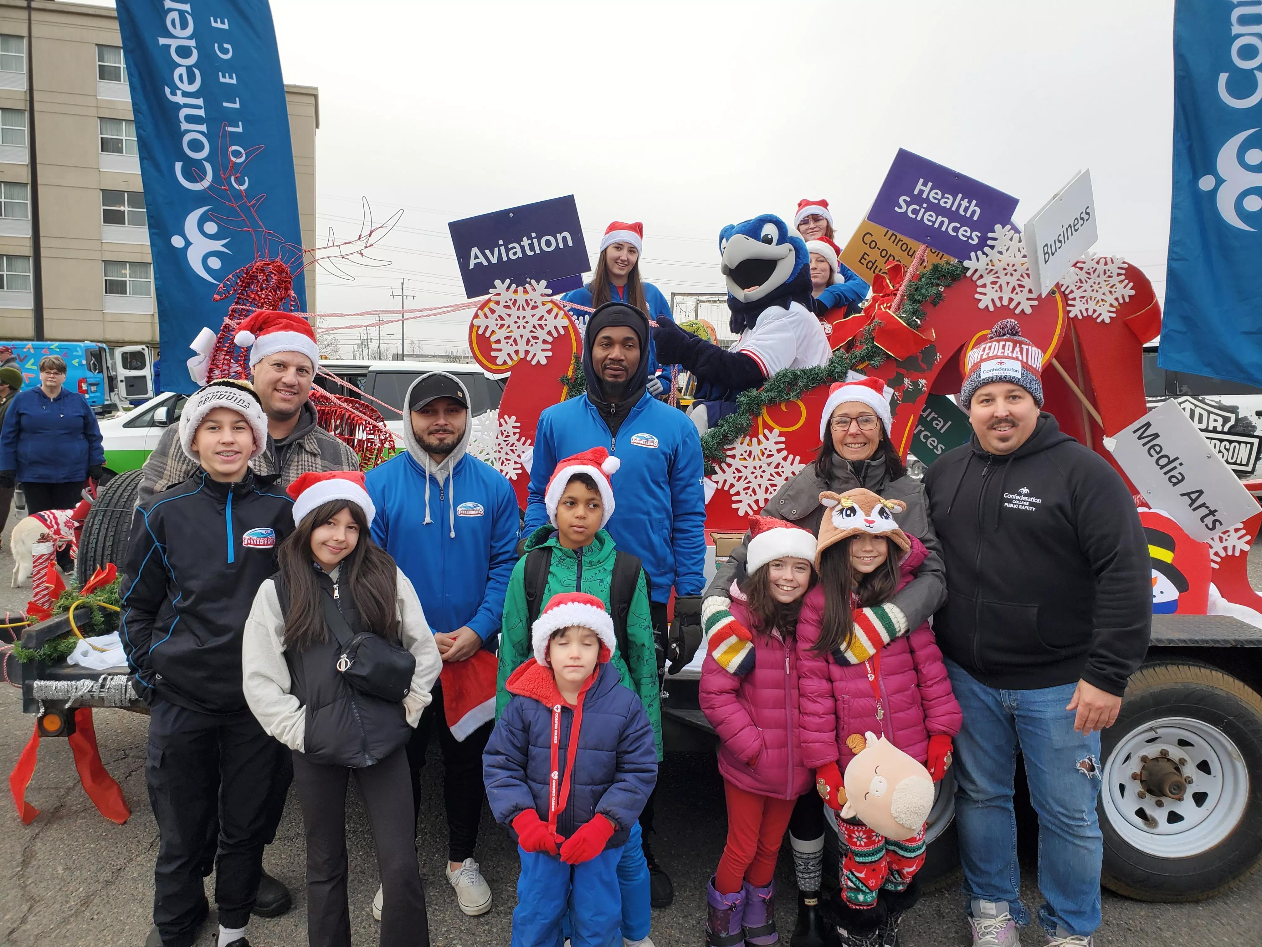 Confederation College staff, students, and families on a holiday parade float