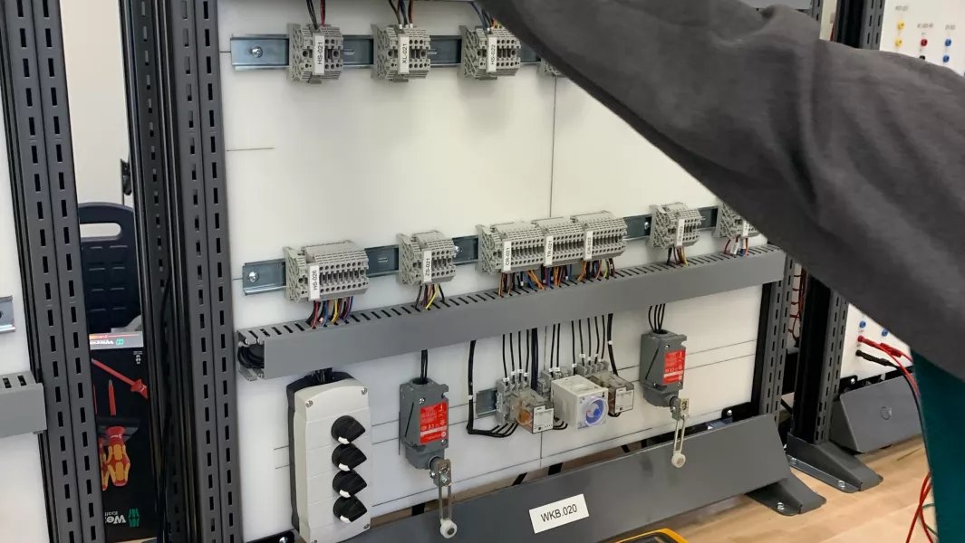 Electrical training panel with wiring terminals and switches