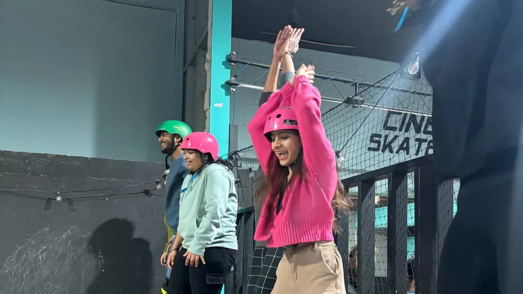 Students cheering and preparing to skate at an indoor skate park
