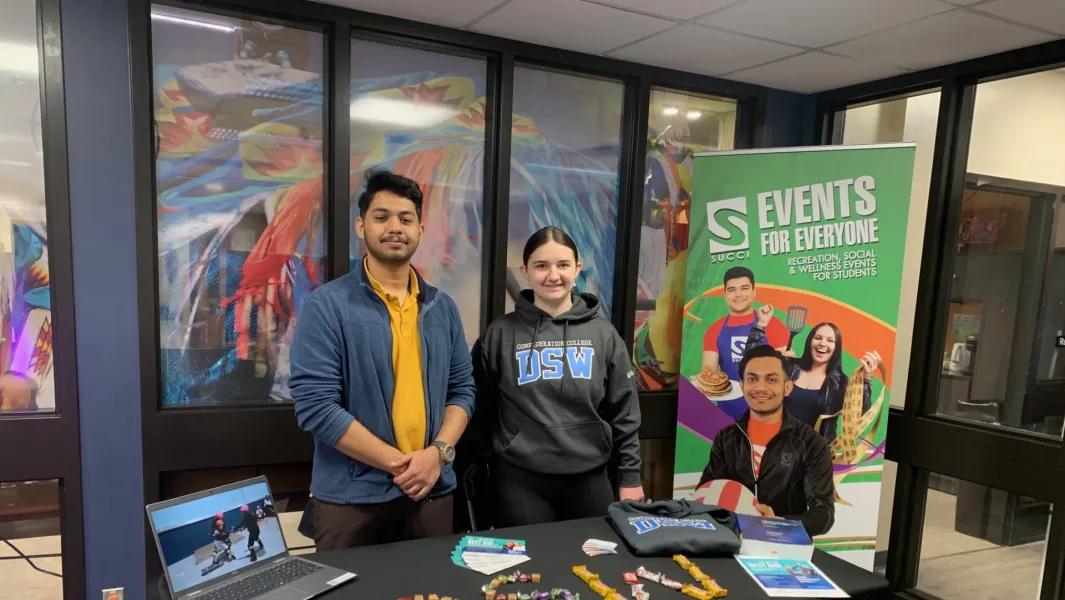 Students hosting a DSW program booth promoting campus events