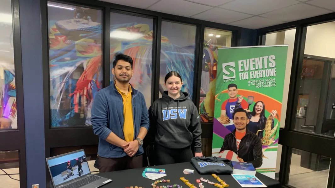 Students hosting a DSW program booth promoting campus events