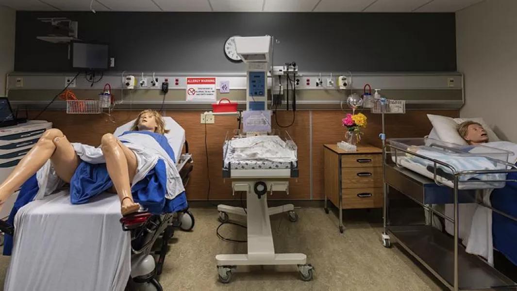 Hospital simulation room with maternity and patient mannequins