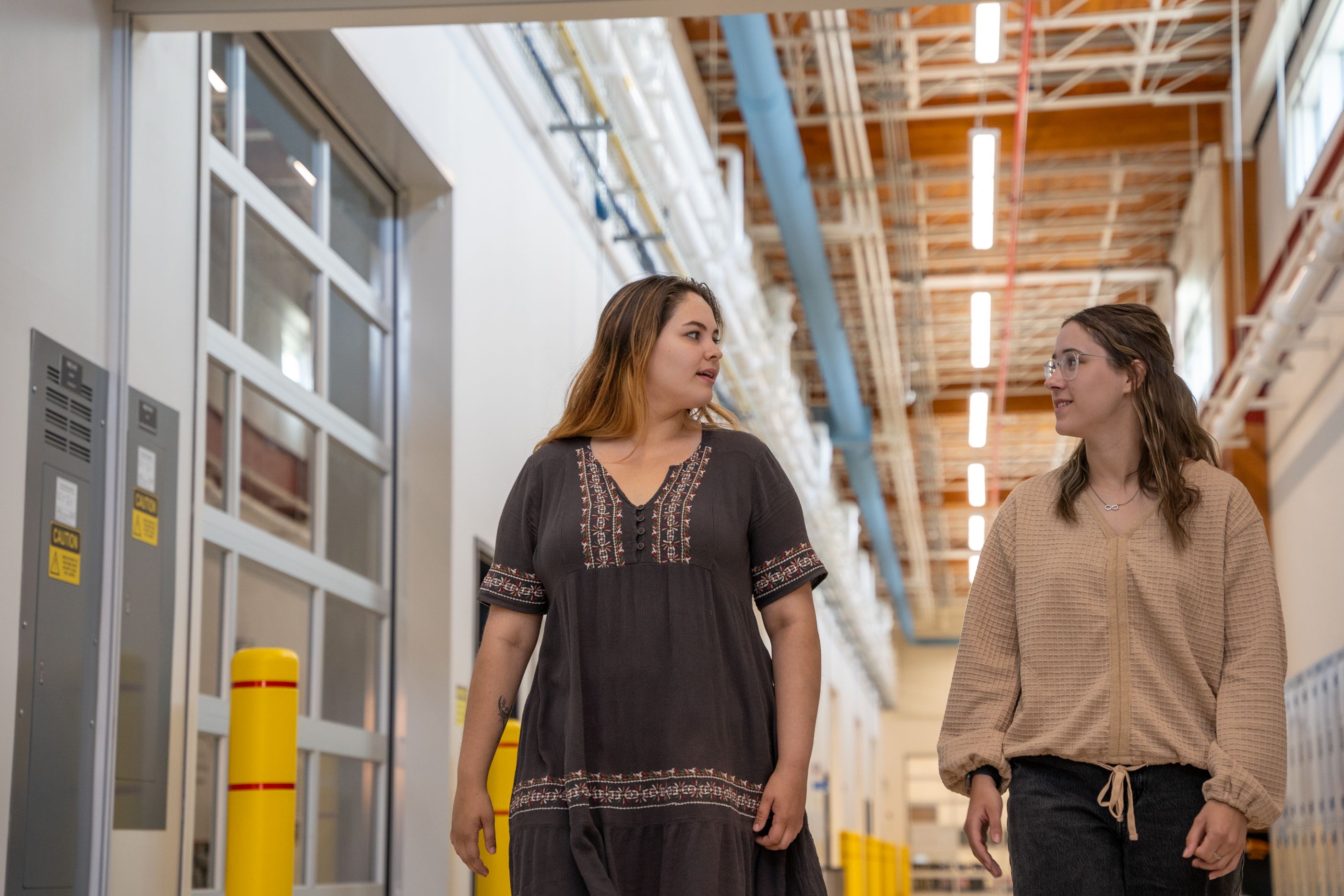 Students walking through the TEC Hub corridor at Confederation College