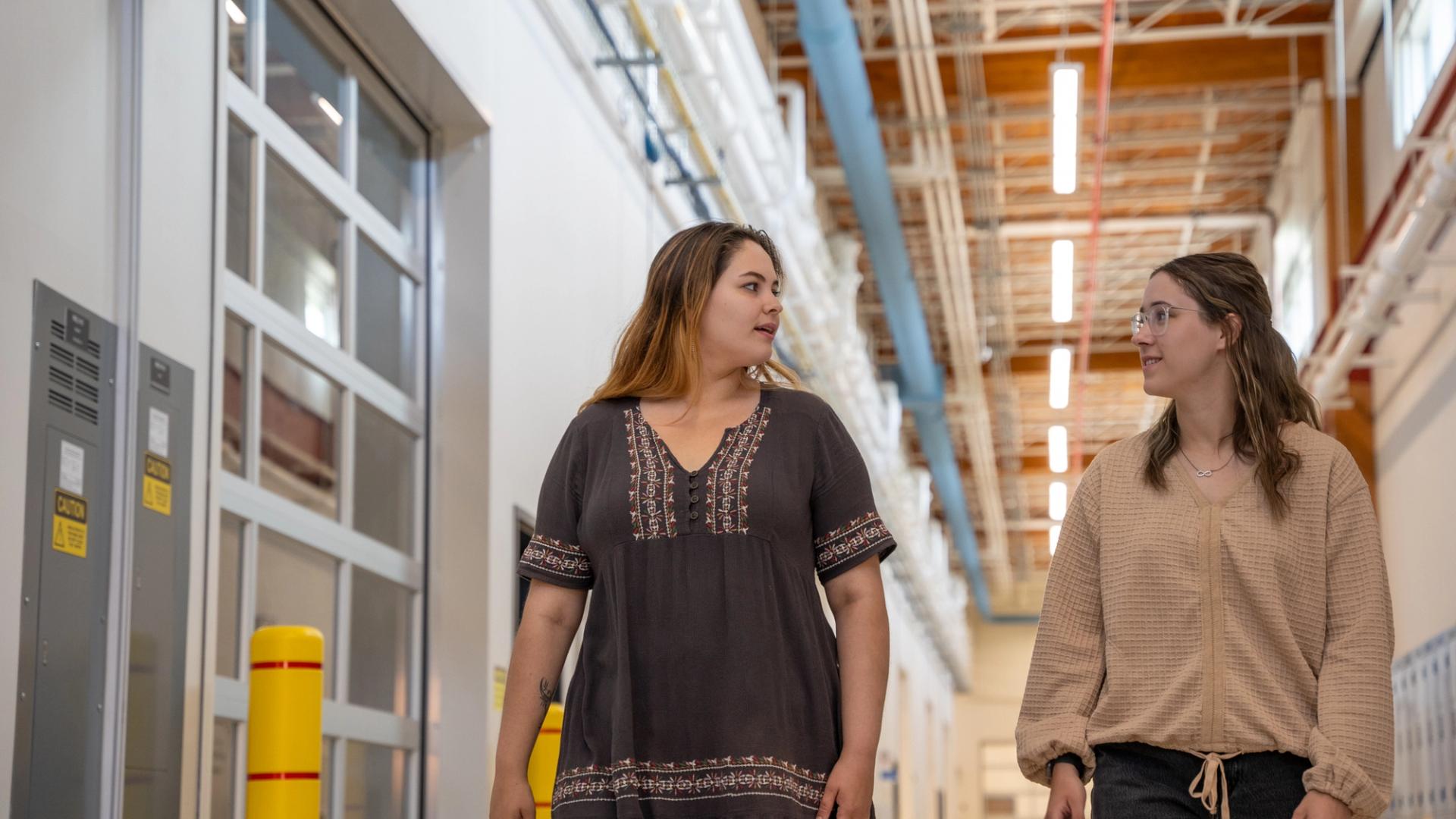 Students walking through the TEC Hub corridor at Confederation College