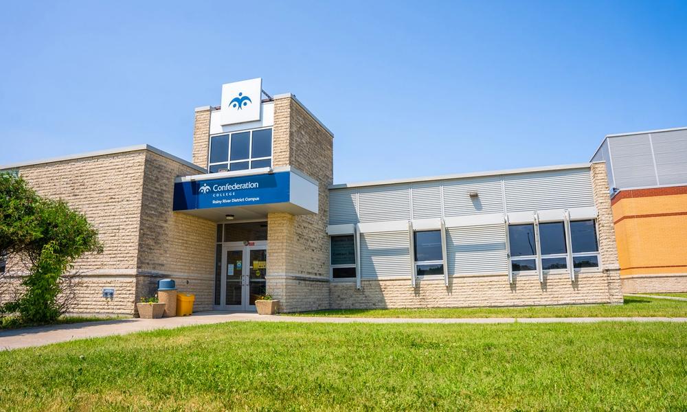 Rainy River District Campus campus Confederation College Rainy River District Campus building with a blue entrance sign and grassy foreground