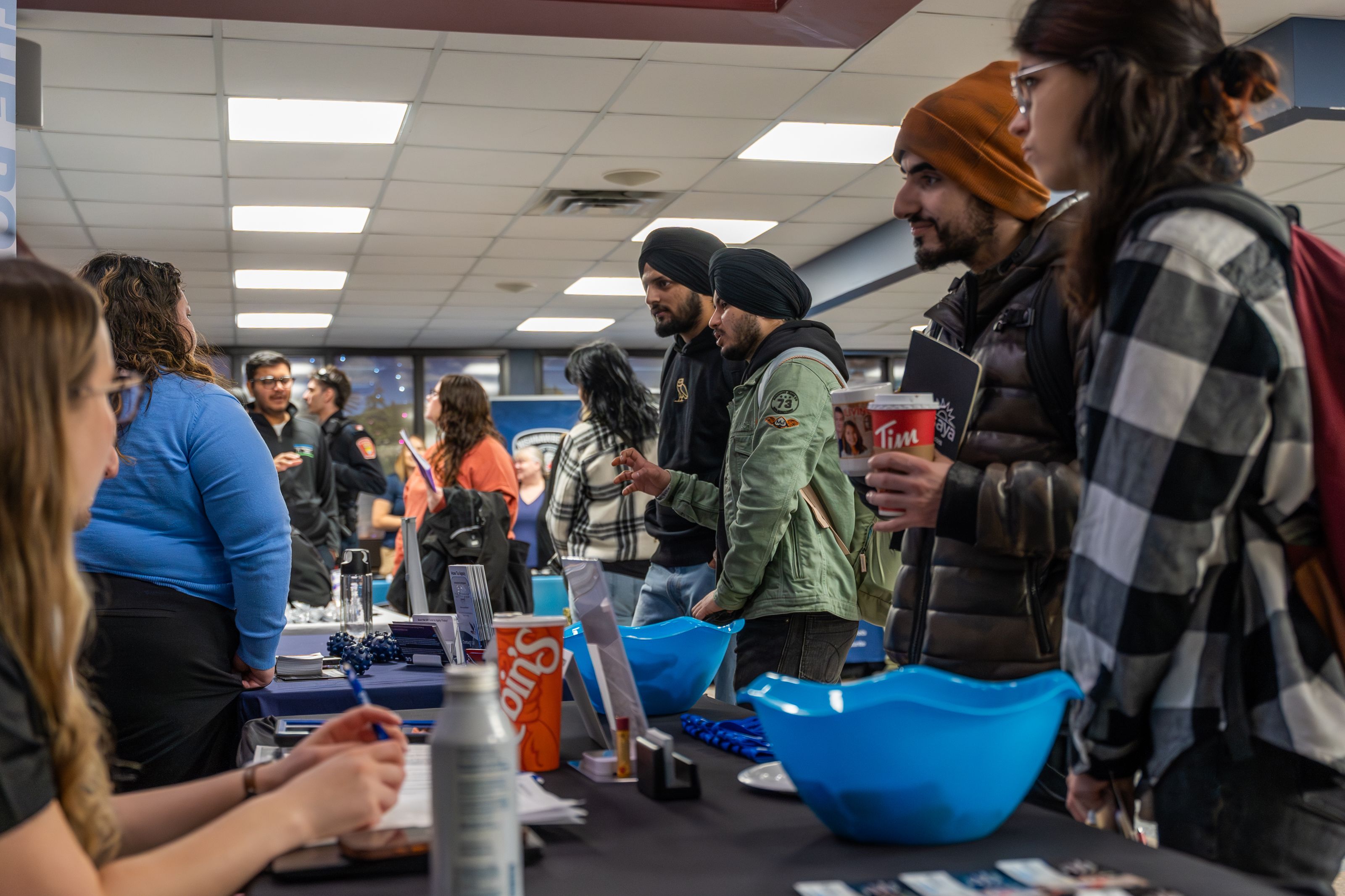 Students connecting with employers at campus career fair