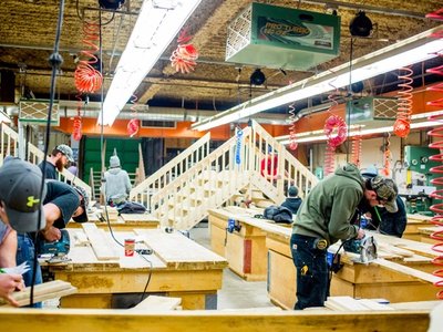 Carpenter apprenticeship students building wooden structures in a workshop