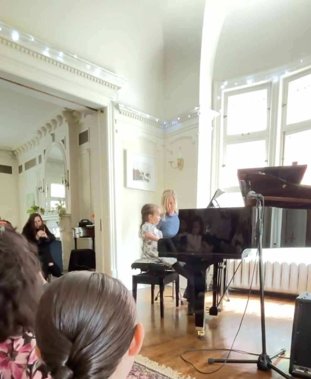Kara playing Fire Fly duet with Olya at the Spring Piano Recital 2026.