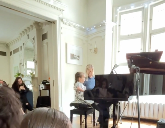Kara playing Fire Fly duet with Olya at the Spring Piano Recital 2026.