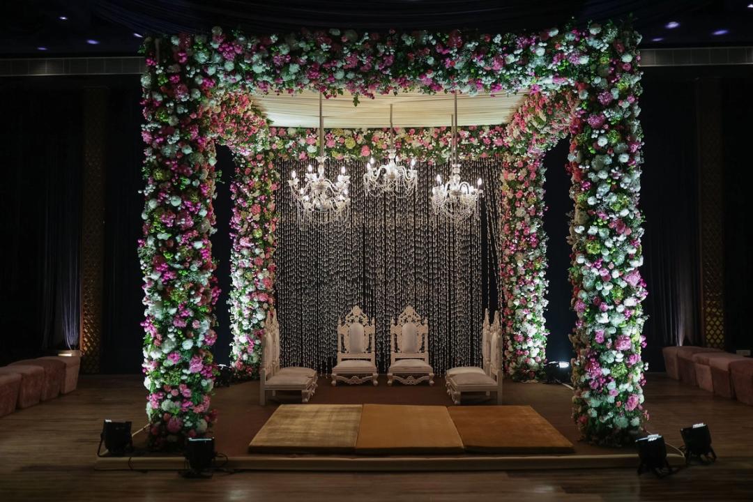 Floral mandap lit up at night