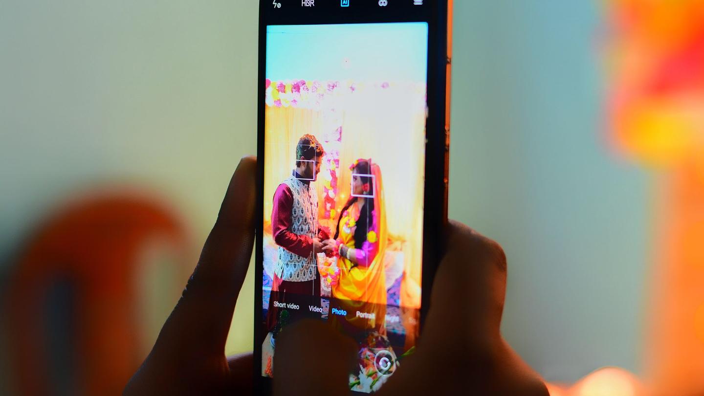 Phone screen showing the bride and groom
