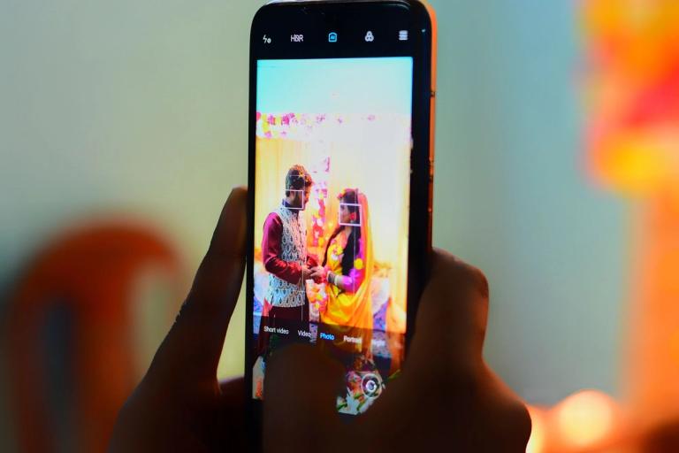 Phone screen showing the bride and groom