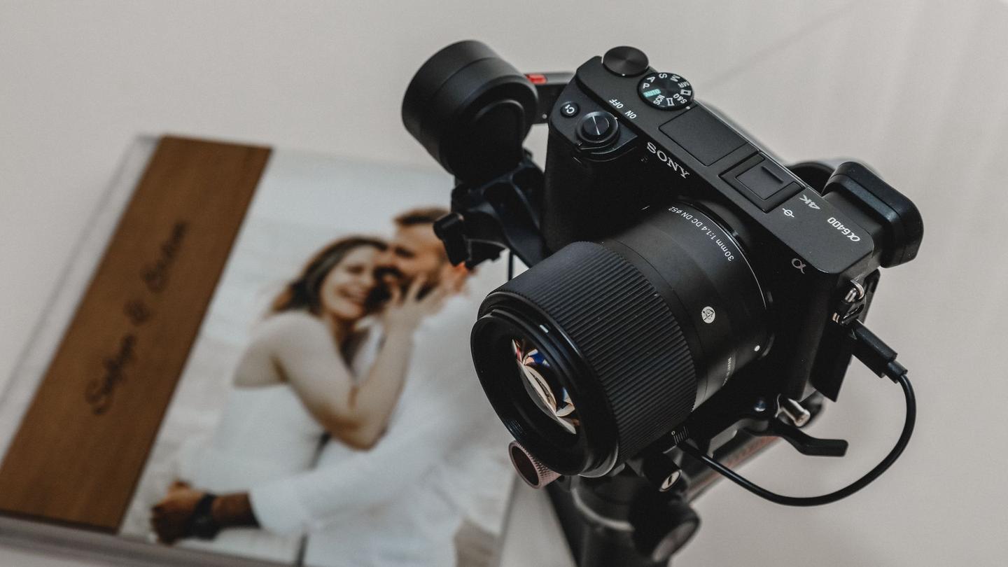 Camera resting on an open wedding album