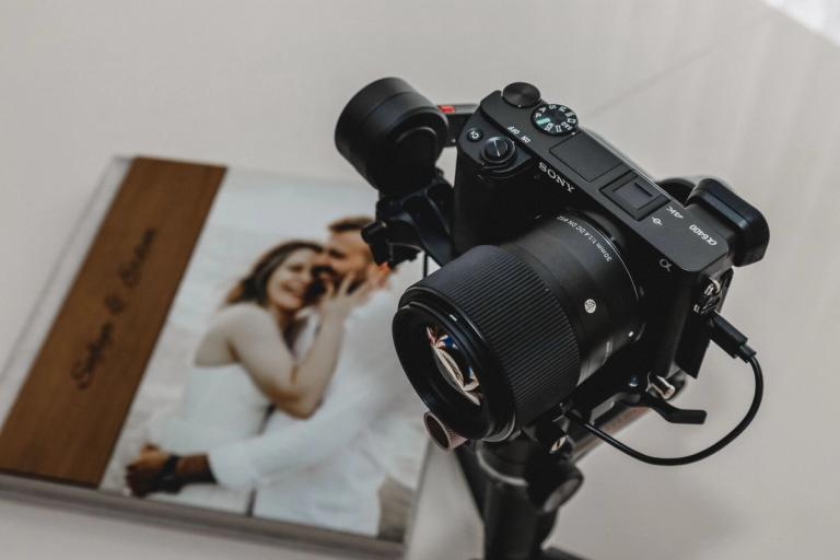 Camera resting on an open wedding album