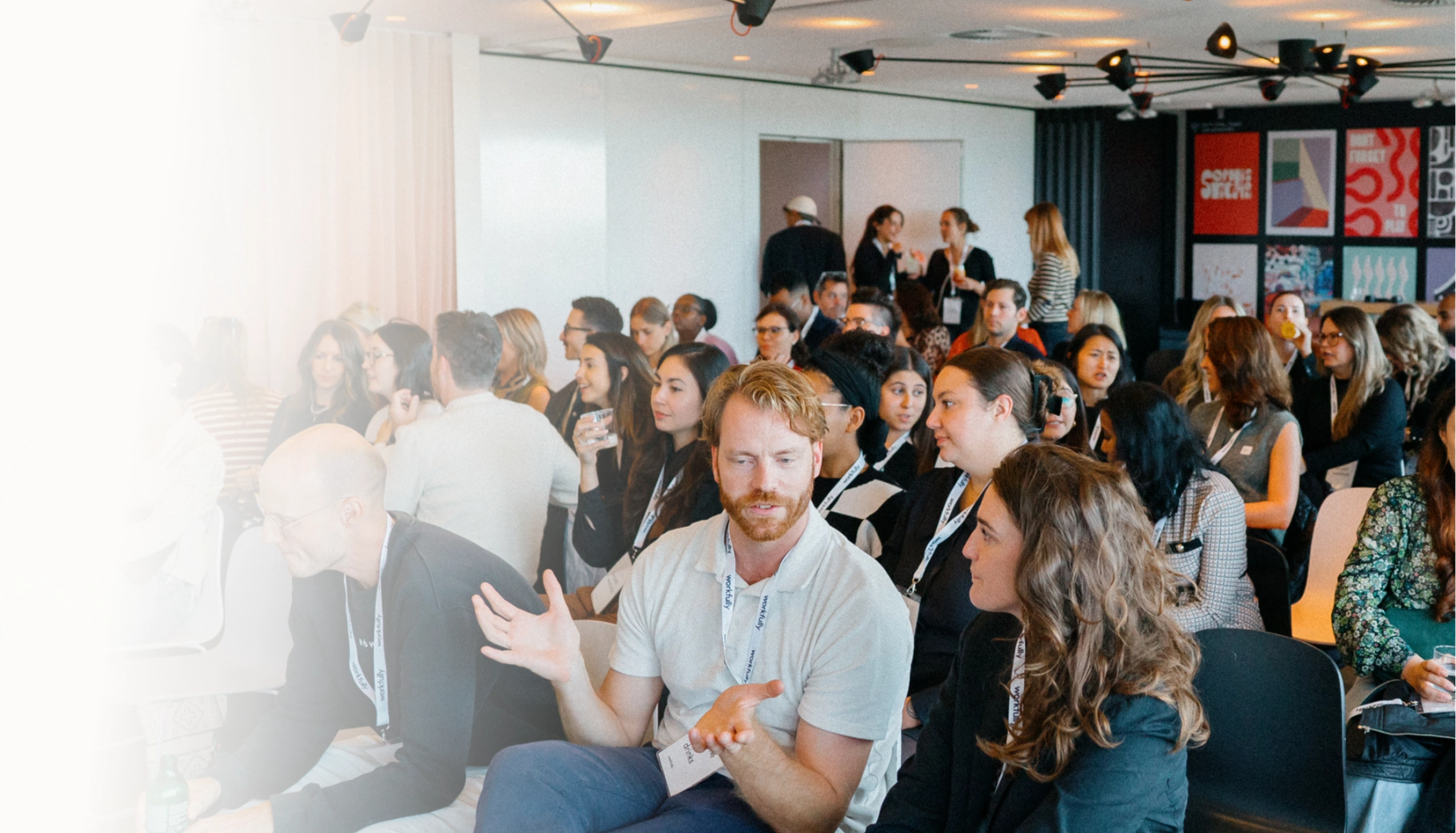 Professionals seated at a conference session in a modern venue