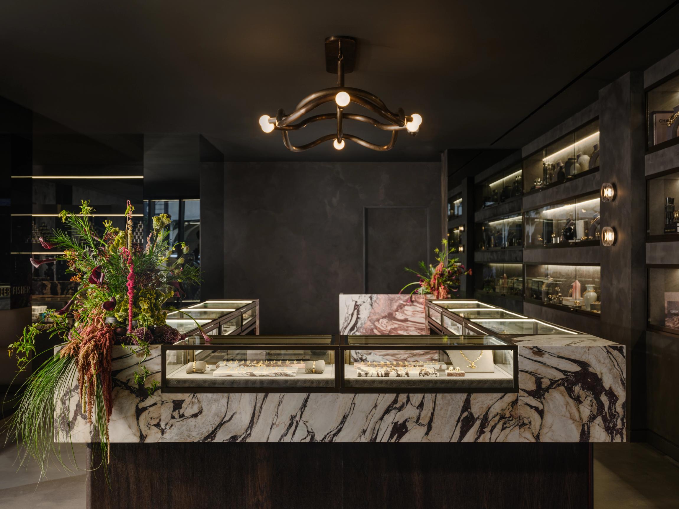 Jennifer Fisher Madison Avenue Store showing light fixtures, jewelry, marble cases