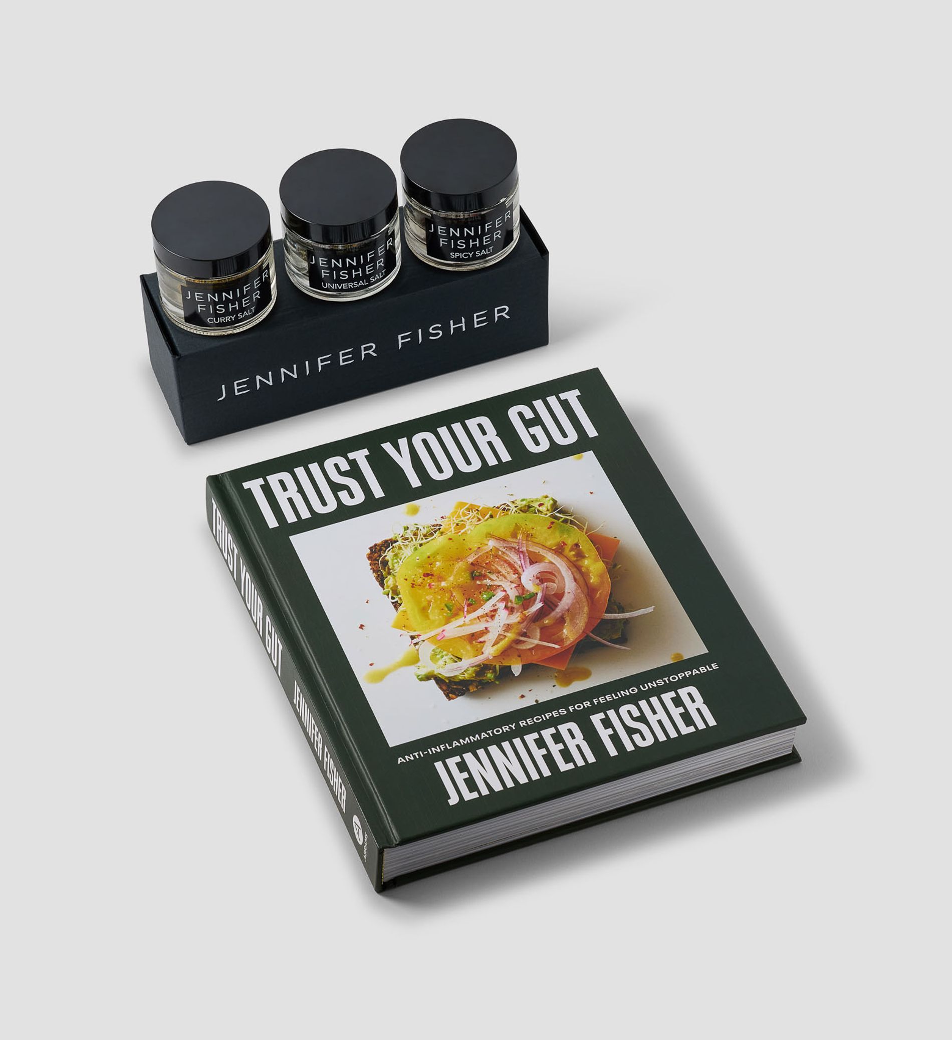 model with short hair in a black top wearing capital gothic letter charms on a gold chain with diamonds