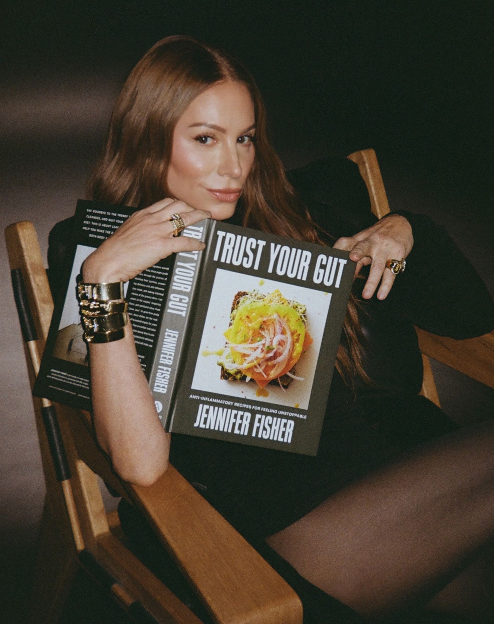 capital gothic letter J charm with diamonds on a grey background