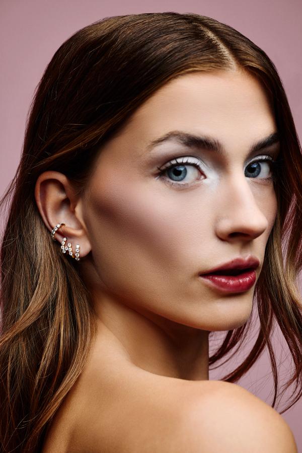 woman with diamond hoop earrings 