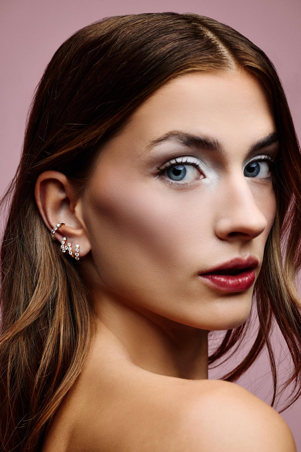 woman with diamond hoop earrings