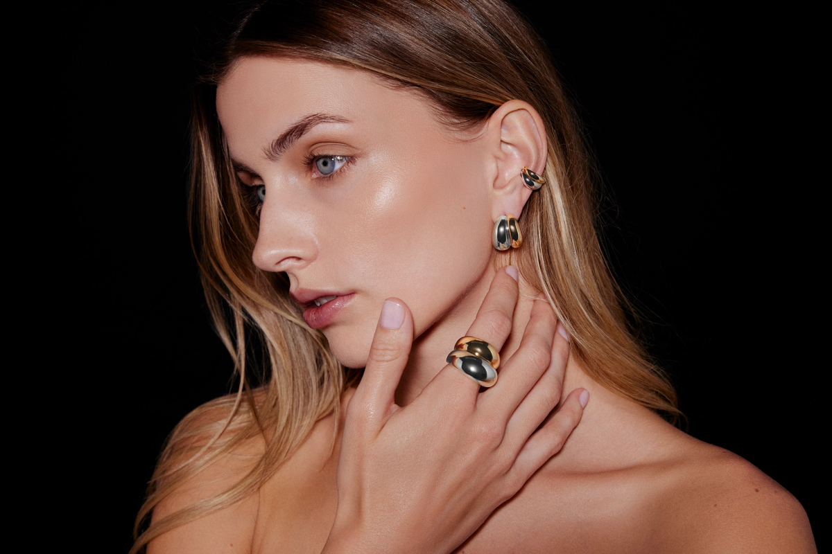 woman posing with two tone jewelry