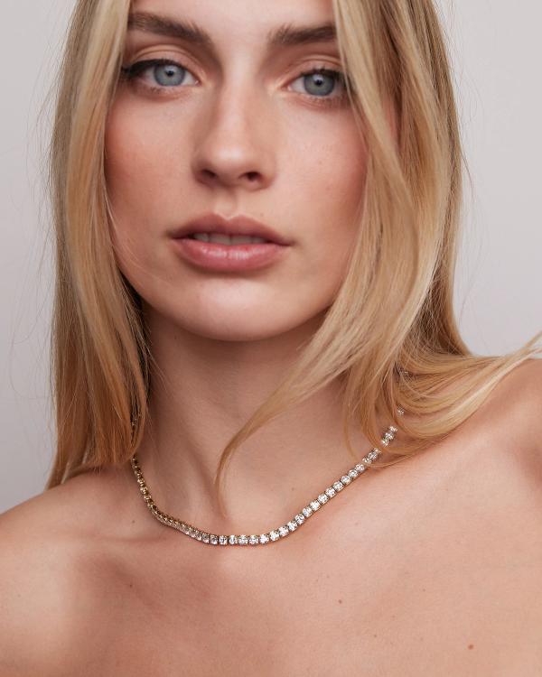 woman wearing a diamond necklace