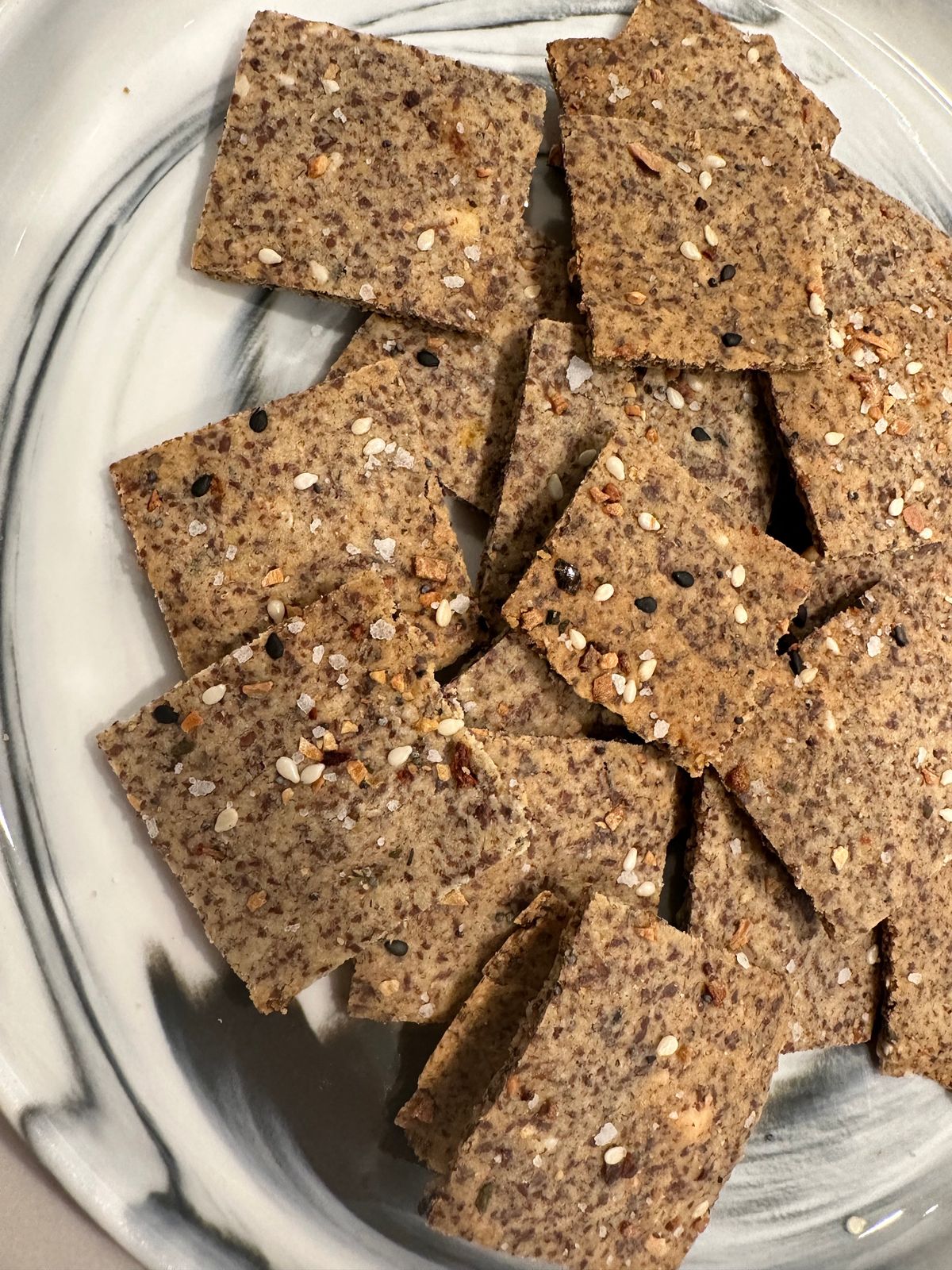 Crackers on a plate topped with special salt