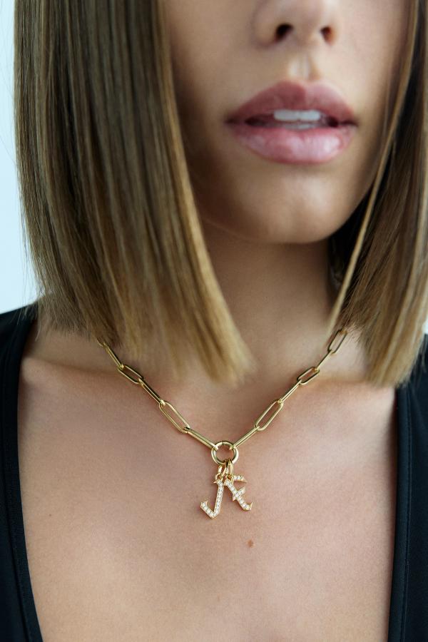 woman with a chain and diamond charms