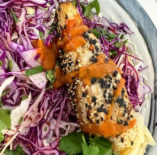 Sesame Crusted Cod on a bed of spicy slaw.  