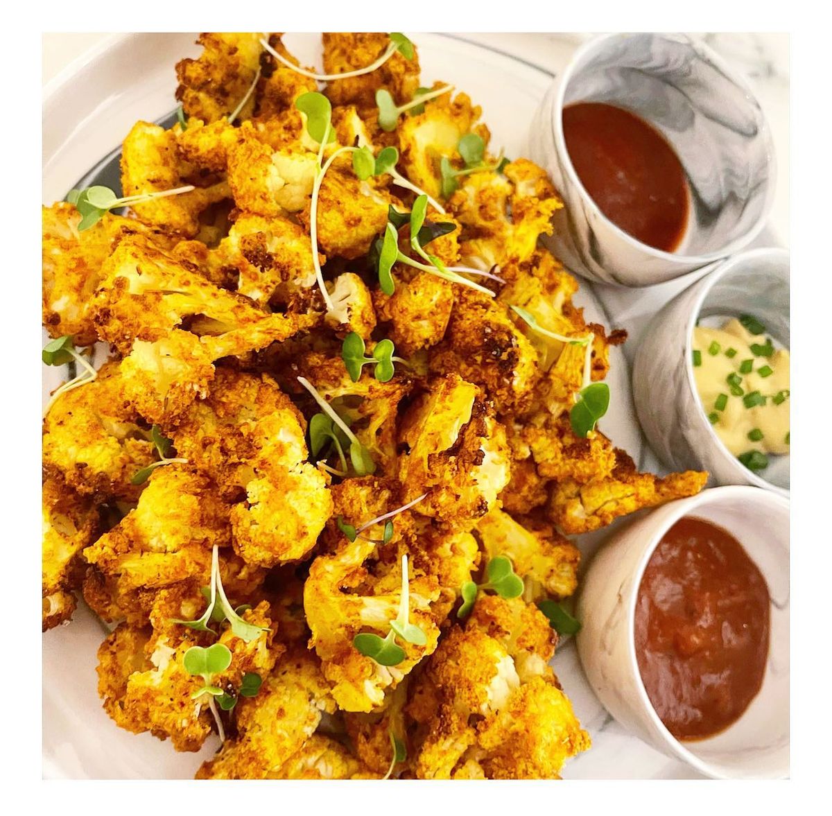 Close up image of cooked cauliflower on a plate