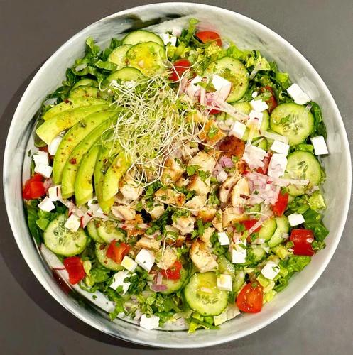 Salad bowl packed with greens, cucumber, cherry tomatoes, radish, vegan feta, avocado and sliced grilled chicken. Topped with sprouts and JF Mustard Vinaigrette. 