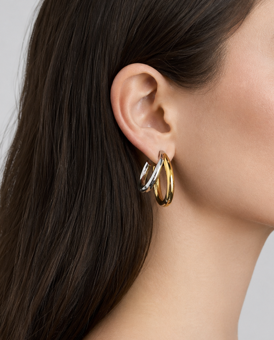 Model with two tone double lilly hoops