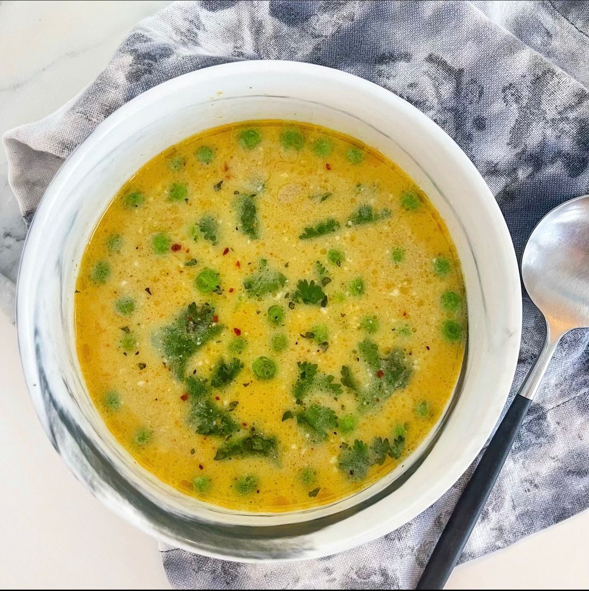 Coconut curry broth in bowl