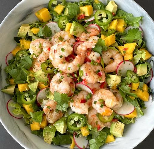 Crunchy romaine lettuce topped with avocado, mango, radish, sautéed shrimp, and a sprinkle of JF Spicy Salt 