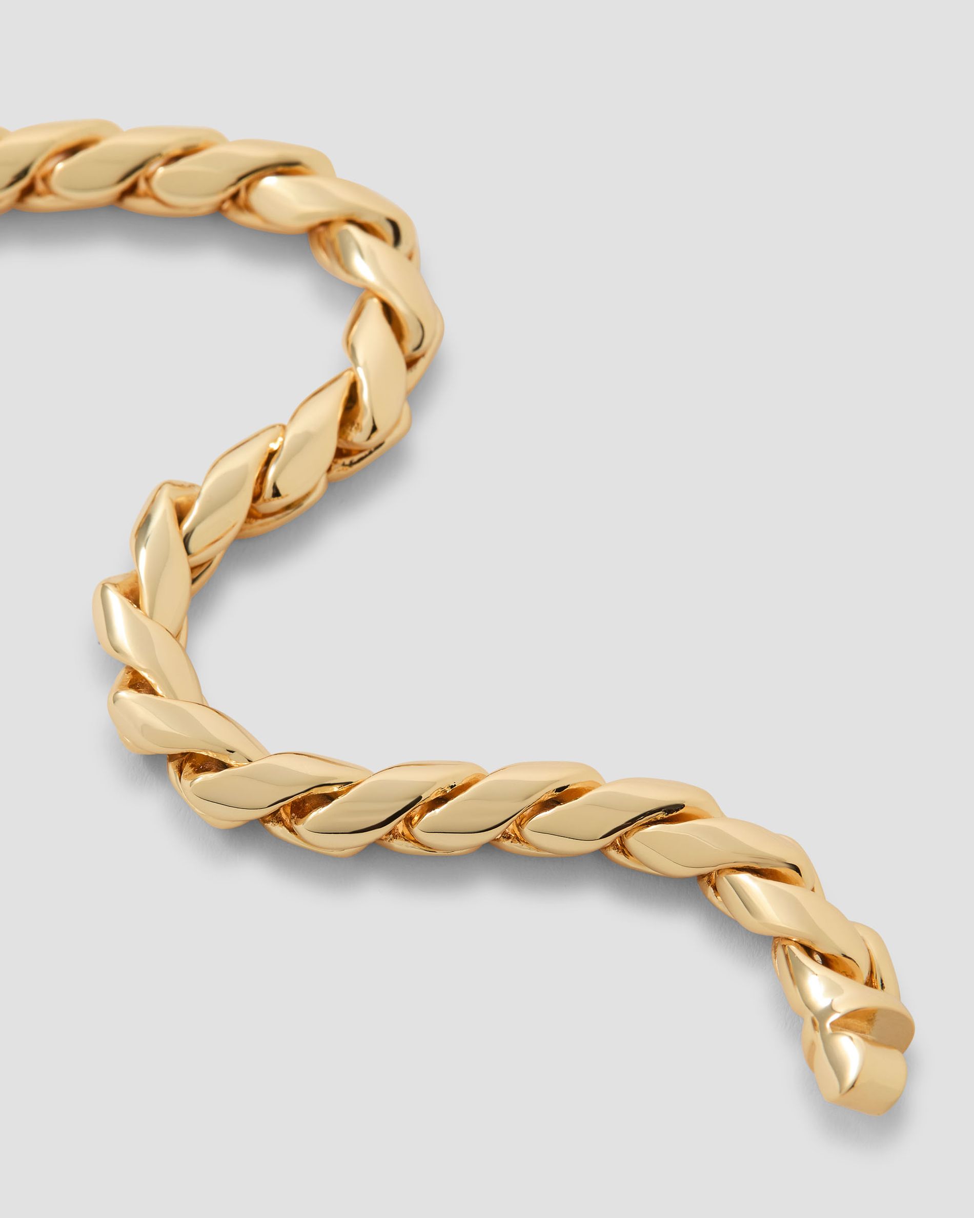 Gold chain on a grey background